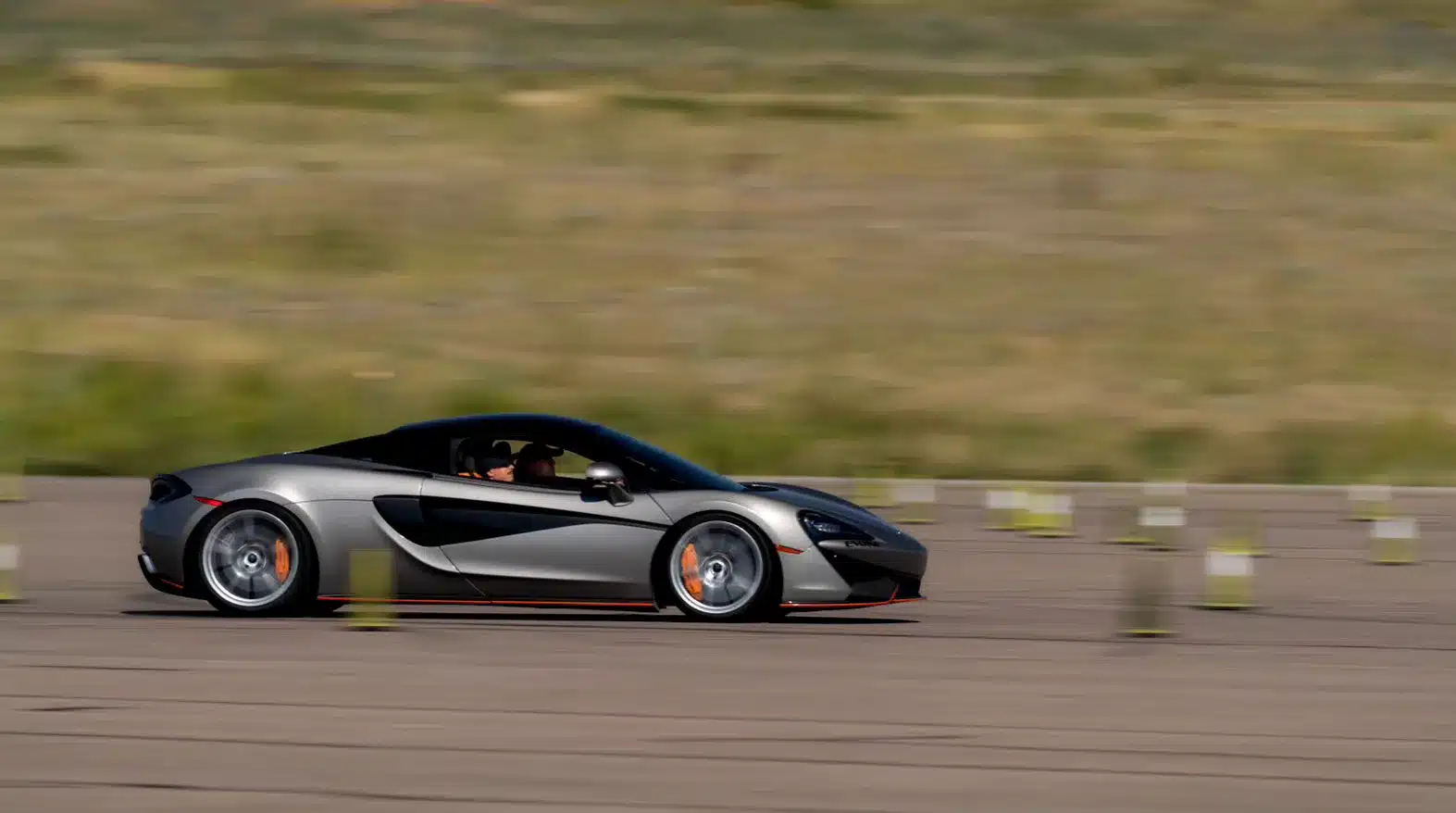 McLaren with a custom fiber body kit on speedway.